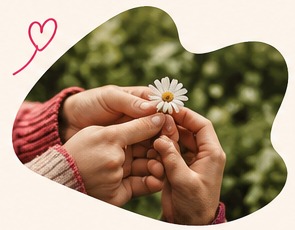 Hands sharing a small flower, a thoughtful everyday gesture